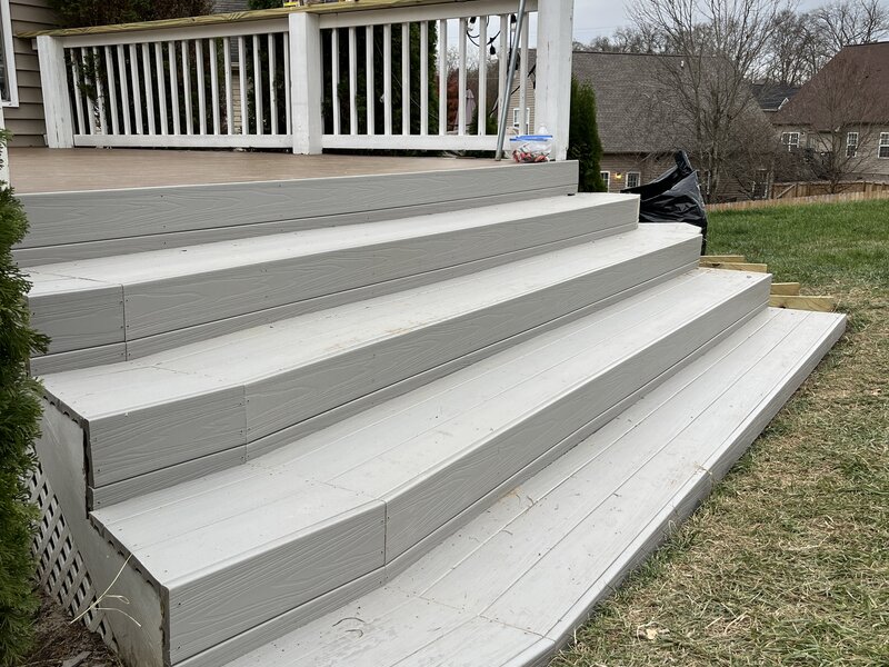 New gray composite deck after renovation by JN Contractor LLC