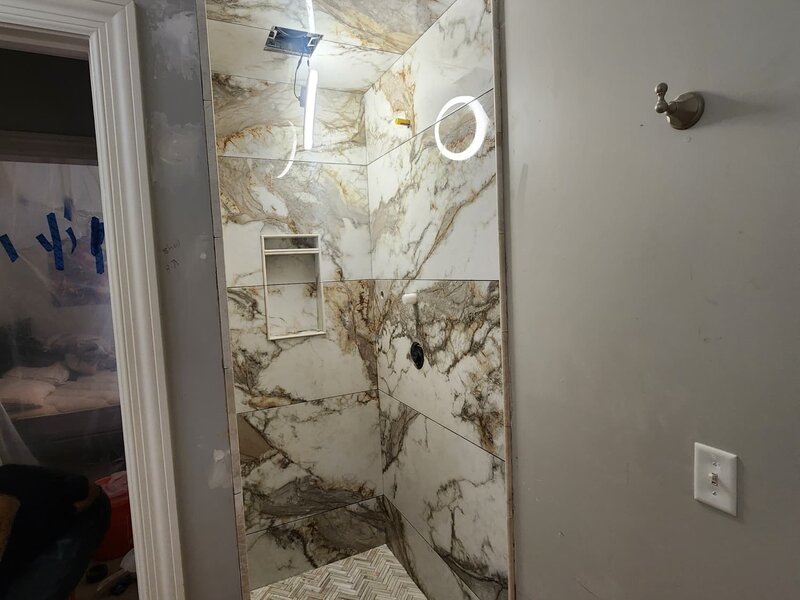 Shower tile remodel in progress by JN Contractor LLC