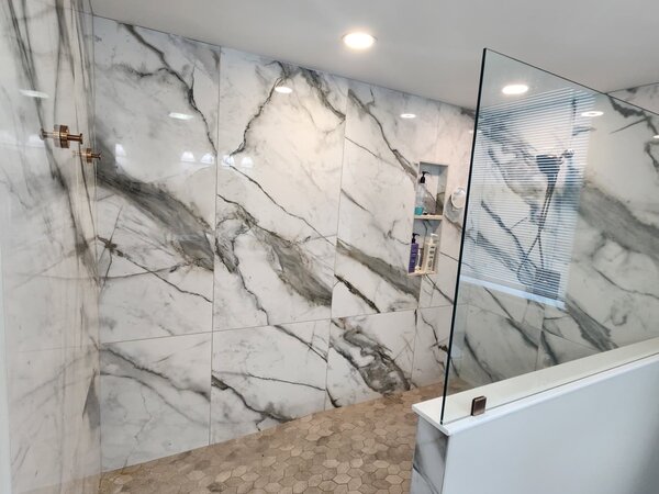 Marble shower tile remodel with hex floor in Smyrna TN