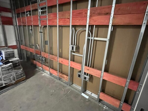 Metal stud framing with wood blocking on commercial wall in Nashville TN